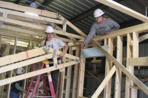 Participants in Vermont Works for Women’s trade-skills training program learn house framing.
 Credit: Vermont Works for Women