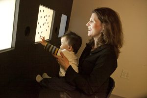 Elizabeth Brannon photographed in her lab in the LSRC. Release for child is on file.